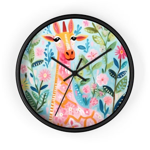 May include: A round wall clock with a black frame features a colorful illustration of a giraffe with pink and orange spots standing in a field of pink and blue flowers.