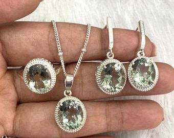 Conjunto de colar e brincos combinando em prata de lei com ametista verde natural e corte oval.