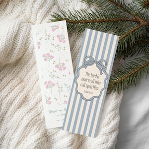 May include: Two decorative bookmarks. One features pink floral sprigs on a white background. The other has blue and white vertical stripes with a bow and the text "The Lord is near to all who call upon Him." Psalm 145:18.