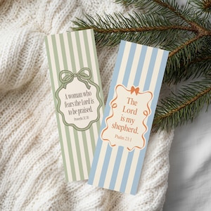 May include: Two vertical striped bookmarks. One is green and cream with the text "A woman who fears the Lord is to be praised." The other is blue and cream with the text "The Lord is my shepherd."