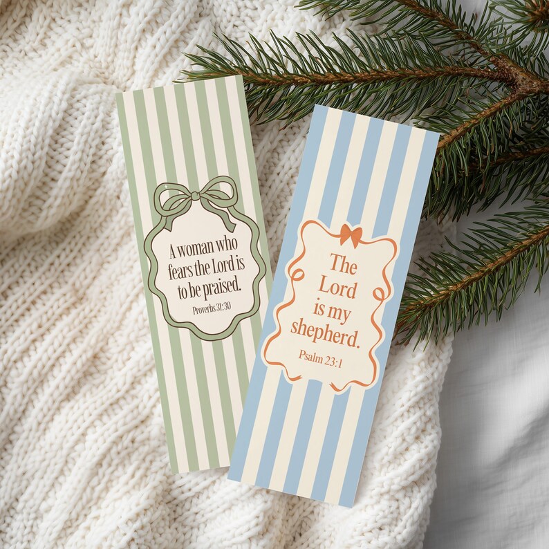 May include: Two vertical striped bookmarks. One is green and cream with the text "A woman who fears the Lord is to be praised." The other is blue and cream with the text "The Lord is my shepherd."