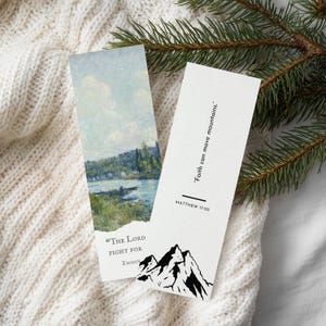 May include: Two rectangular bookmarks. One features a landscape painting with a river and trees. The other has the text "Faith can move mountains" and a mountain illustration. The text "MATTHEW 17:20" is also present.