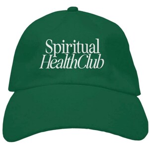 May include: A green baseball cap with the text "Spiritual Health Club" embroidered in white on the front.