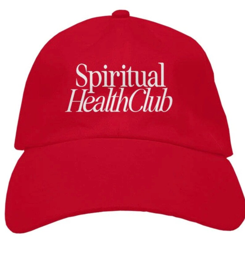 May include: A red baseball cap with the white text "Spiritual Health Club" embroidered on the front.