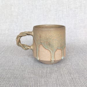 Handmade Stoneware Mug: Braided Handle, Green Drip Glaze, Rustic Pottery, Artistic Design 400 ml