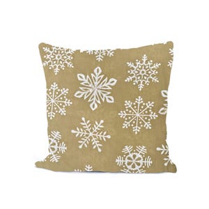 May include: Square decorative pillow with a tan background and a repeating pattern of white snowflakes. The snowflakes vary in size and design, creating a festive winter theme. The pillow is likely made of a soft fabric.