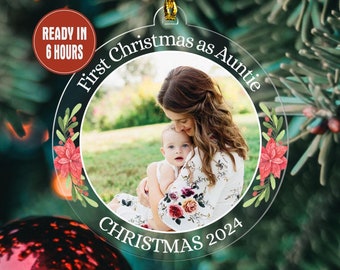 May include: Clear acrylic Christmas ornament with a photo of a woman and a baby. The ornament reads "First Christmas as Auntie CHRISTMAS 2024" with a floral design. A red circle indicates the item is ready in 6 hours.