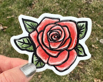 May include: A red rose with green leaves, drawn in a watercolor style. The rose is outlined in black and has a detailed center.
