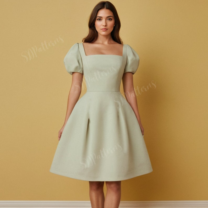 May include: A light green short-sleeved dress with a square neckline and a fitted bodice. The dress has a full skirt and a short length.