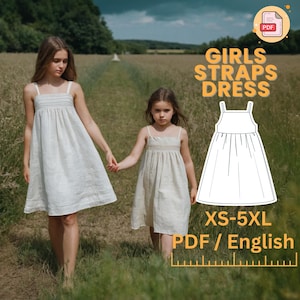 Peut inclure: Un patron de robe à bretelles pour filles en téléchargement numérique PDF. Le patron comprend un dessin au trait de la robe et le texte "Girls Straps Dress" et "XS-5XL PDF/English".