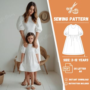 May include: A sewing pattern for a white dress with puffed sleeves. The pattern is for sizes 2-12 years and is available as a PDF download. The pattern includes instructions.