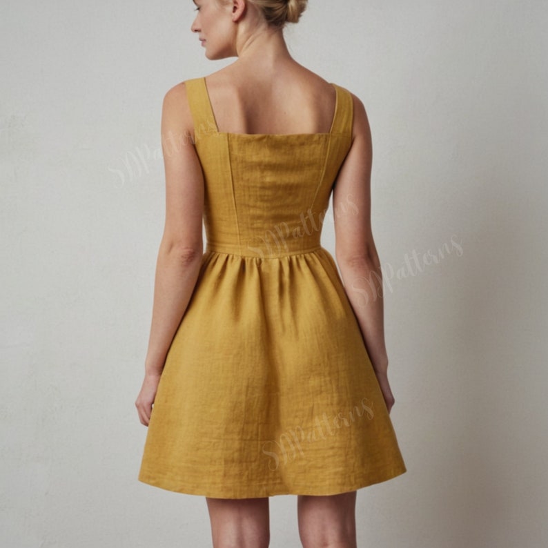 May include: A sleeveless, yellow linen dress with a square neckline and a fitted bodice. The dress has a gathered skirt and a slightly flared silhouette.