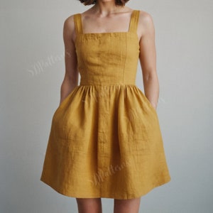 May include: A yellow linen dress with a square neckline, thin straps, and pockets. The dress has a fitted bodice and a flowy skirt.