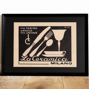 May include: Black and white illustration of a knife, fork, spoon, wine glass, and plate with the text "VIA TORINO ANGOLO VIA UNIONE" and "La Ceramica MILANO".