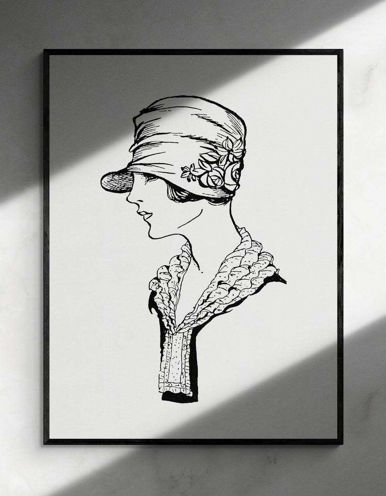 May include: A black and white line drawing of a woman wearing a cloche hat with a floral embellishment and a crocheted collar.