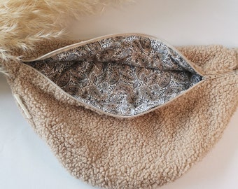 Beige sherpa fleece fanny pack with mandala pattern interior lining