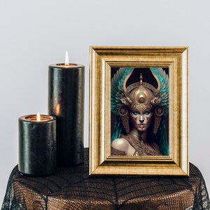 May include: A framed print of a woman wearing a gold and turquoise headdress with intricate details. The woman has a serious expression and is looking directly at the viewer. The background is a dark blue.