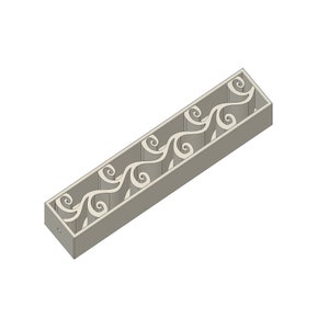 May include: A grey rectangular mould with a decorative pattern of swirling lines. The mould is designed for creating decorative items.