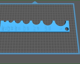 May include: A light blue plastic tool with a series of graduated holes, labeled with fractions of an inch, for measuring the diameter of pipes or other round objects. The tool is 3D printed and has a hole at one end for hanging.