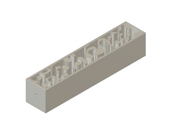 May include: A gray, rectangular, 3D printed mold with a series of holes and channels running along its length. The mold is designed for creating a decorative object.
