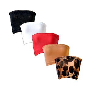 May include: Five different tube tops in various colors and patterns. The tube tops are made of a soft, stretchy fabric. The colors include black, white, red, tan, and leopard print.