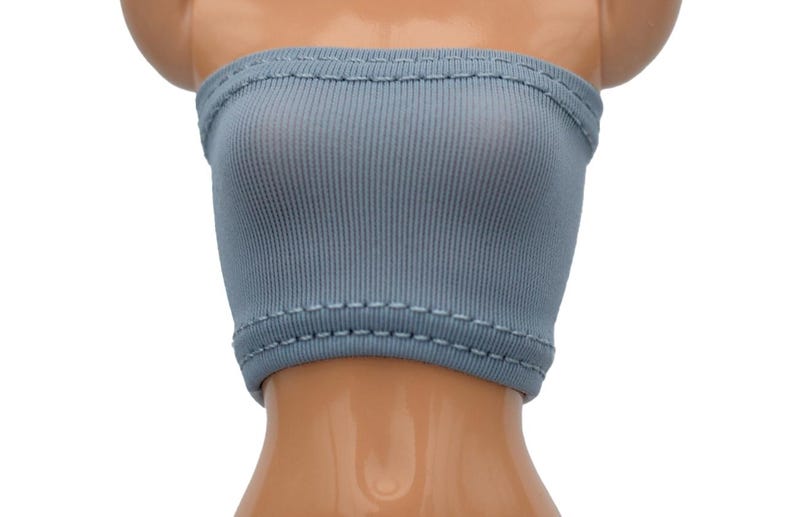 May include: A light blue ribbed tube top with a stitched hem.