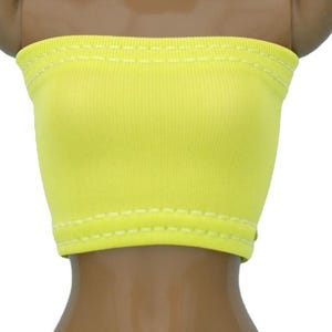 May include: A bright yellow tube top with white stitching around the edges.
