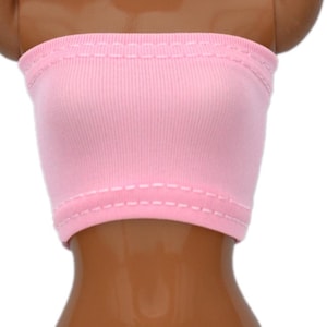 May include: A pink strapless tube top with white stitching around the edges.