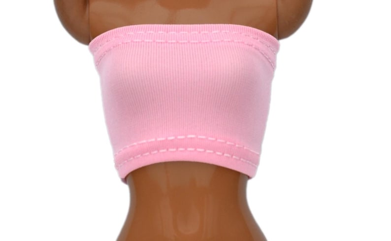 May include: A pink strapless tube top with white stitching around the edges.