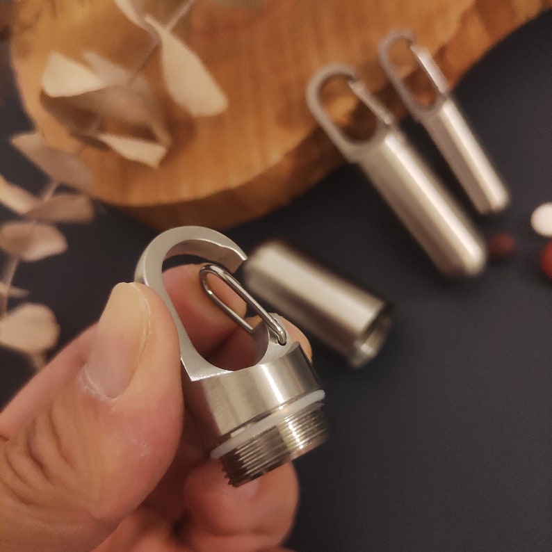 Metal keychain ,Metal pill case, Waterproof mini pill box, Pendant keychain, Sealing waterproof pill jar image 2