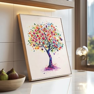 May include: A framed watercolor painting of a colorful tree with a gold frame. The tree has a purple trunk and branches filled with red, orange, and purple fruit. The background is a light cream color.