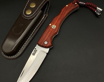 Navaja plegable de acero inoxidable 4116 con empuñadura Paduk y funda de cuero