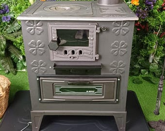 Estufa de leña de hierro fundido con horno: Calefactor y cocina compactos para cabañas