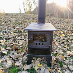 caravan stove, wood stove, camping stove, cast iron stove, mountain hut stove, patio stove, coal stove, prefabricated house stove,