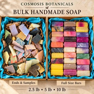 May include: Two cardboard boxes filled with handmade soap. The left box contains assorted soap ends and samples, while the right box holds rows of full-size bars wrapped in plastic. Text reads COSMOSIS BOTANICALS, BULK HANDMADE SOAP, Ends & Samples, Full Size Bars, 2.5 lb, 5 lb, 10 lb.