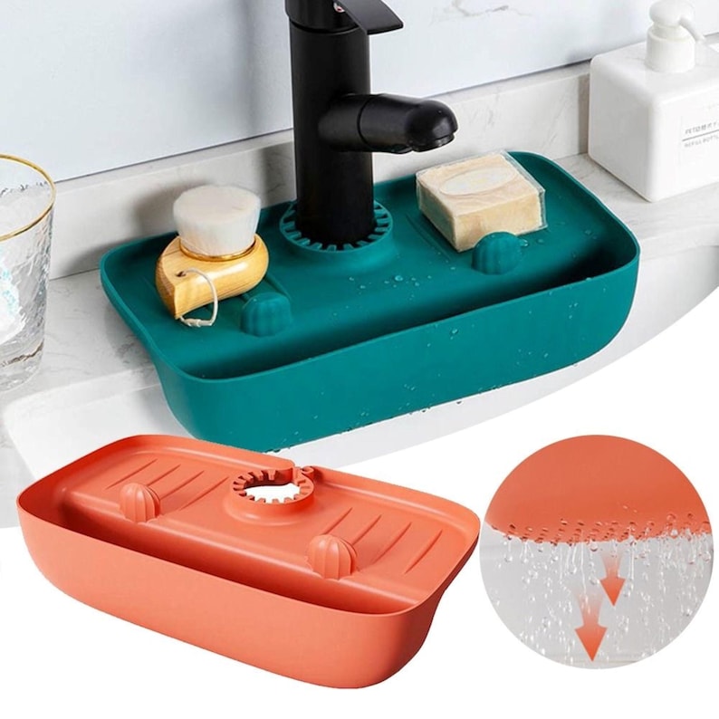 May include: Teal sink caddy with a black faucet, a wooden brush, and a bar of soap. An orange sink caddy is shown below. A close-up shows water flowing through the caddy.