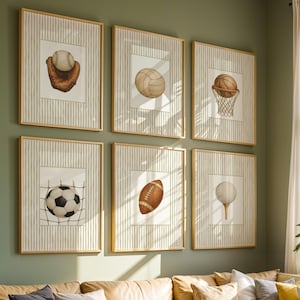 May include: Six framed sports-themed prints. The prints feature a baseball and glove, volleyball, basketball in a hoop, soccer ball in a net, football, and golf ball on a tee. Each print has a beige striped background and a gold frame.