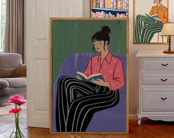 May include: A digital illustration of a woman sitting in a purple armchair, reading a book. She is wearing a pink shirt with white hearts and black and white striped pants. The background is a green wall.