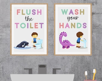 May include: Two framed illustrations with colorful text. The left illustration shows a boy flushing a toilet with a whale swimming in the water below. The right illustration shows a boy washing his hands with a dinosaur standing next to him. The text on the left reads "FLUSH the TOILET" and the text on the right reads "WASH your HANDS".