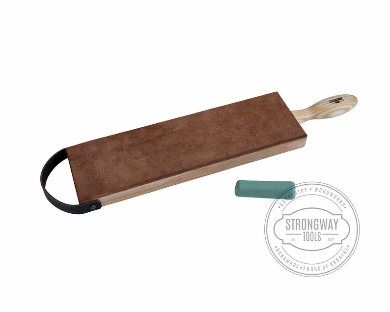 May include: A brown leather strop with a wooden handle and a black metal loop. It is used for sharpening tools. A green sharpening stone is also included.