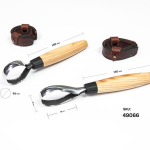 May include: Two wood carving knives with curved blades and wooden handles, each 140 mm long. The blades are silver-colored, and the handles are light brown. Two brown leather sheaths are also included. The SKU is 49066.