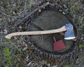 May include: A wooden-handled axe with a leather sheath, resting on a tree stump. The axe head is made of steel and has a sharp edge. The handle is made of wood and has a natural finish. The sheath is made of brown leather and has a flap that secures the axe head.