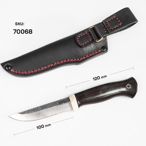 May include: A black leather knife sheath with red stitching and a matching handle knife. The knife blade is 100 mm long, and the sheath is 120 mm long. The SKU is 70068.