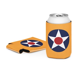 May include: Mustard yellow can cooler with a white star inside a blue circle and a red center. A matching flat cooler is next to the can cooler. The design is reminiscent of a vintage military emblem.