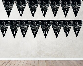 May include: A black and white birthday banner with a camouflage pattern and the words "Happy Birthday" printed on it.
