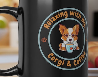 May include: A black ceramic mug featuring a circular graphic with a light blue border. The design shows a cartoon corgi wearing glasses and holding a small blue mug. The text reads Relaxing with my Corgi & Coffee in orange lettering.