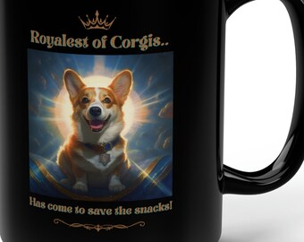 May include: A black ceramic mug featuring a graphic of a corgi with a crown and a sunburst background. The text reads Royalest of Corgis.. above the dog and Has come to save the snacks! below the dog in gold lettering with a small crown icon.