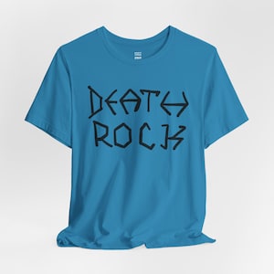 May include: A turquoise blue t-shirt with a black graphic that says "DEATH ROCK" in a stylized font.
