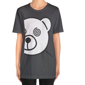 May include: A dark gray t-shirt with a white bear face graphic. The bear has a spiral design in one eye.