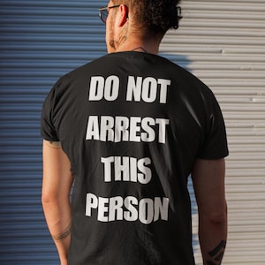Do Not Arrest This Person T-Shirt, Funny Saying T Shirt for Men Women, Quirky Meme Joke Tee Teen Rebel Gift Punk Biker Clothing, Felon, Cop image 1